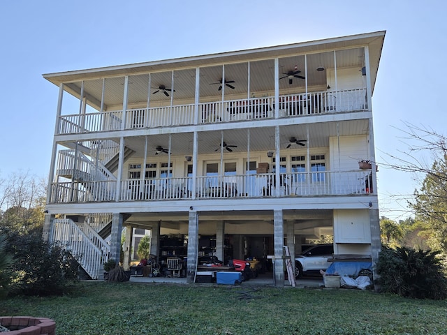 back of house with a patio area and a yard