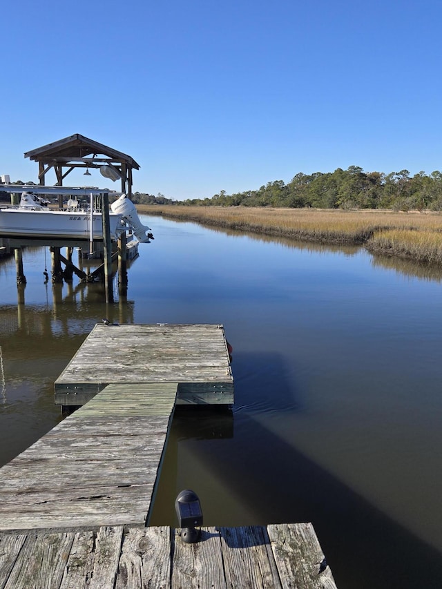 dock area with a water view