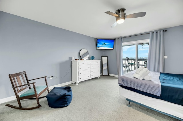 carpeted bedroom with ceiling fan and access to exterior