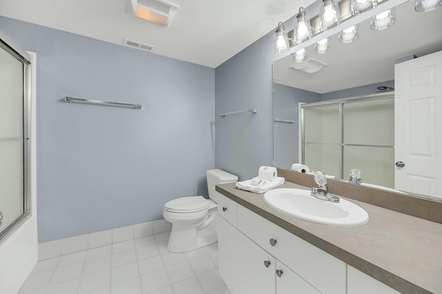 full bathroom featuring combined bath / shower with glass door, vanity, toilet, and tile patterned flooring