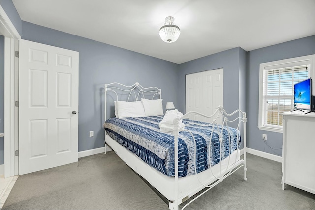 bedroom featuring a closet and carpet floors