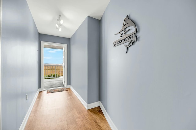 doorway to outside with light wood-type flooring