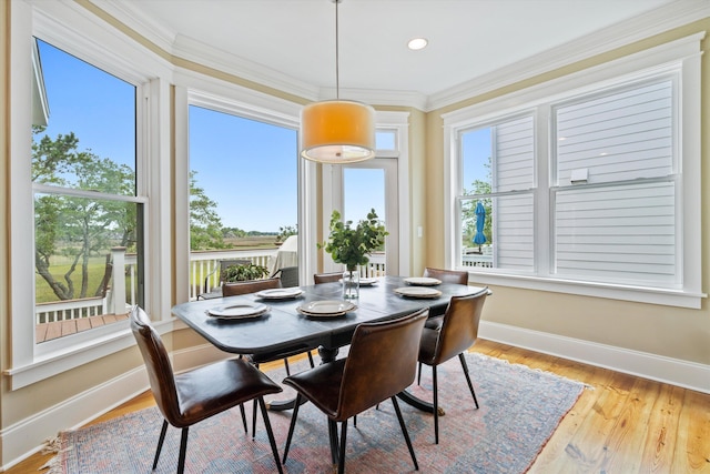 dining space with crown molding, baseboards, wood finished floors, and recessed lighting