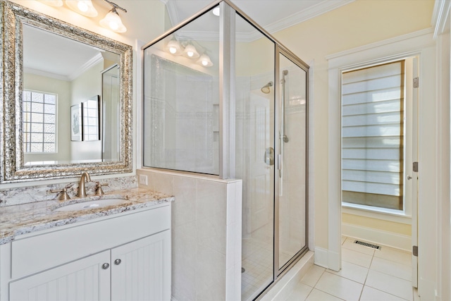 full bath with crown molding, a stall shower, tile patterned floors, and vanity