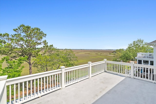 view of patio featuring a balcony