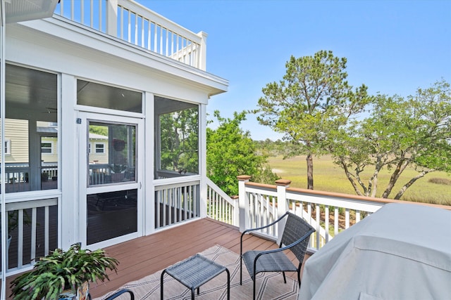 deck with a sunroom