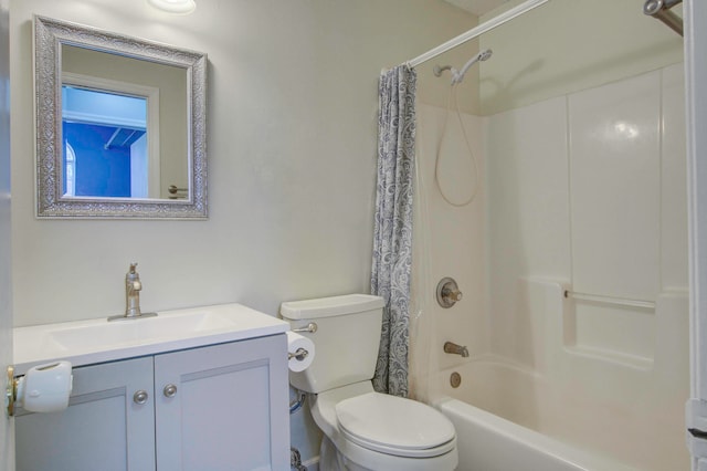 full bathroom with shower / bath combo with shower curtain, toilet, and vanity