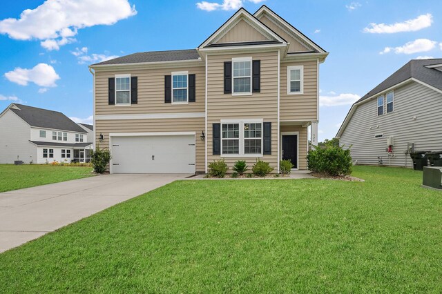 view of front of property with a garage, a front yard, and driveway