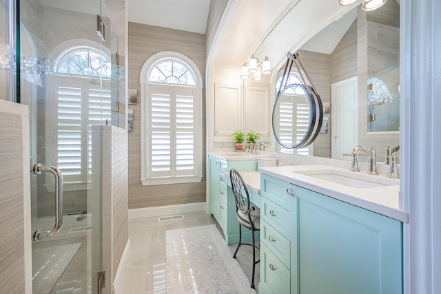 full bath featuring visible vents, two vanities, a sink, tile patterned flooring, and a shower stall