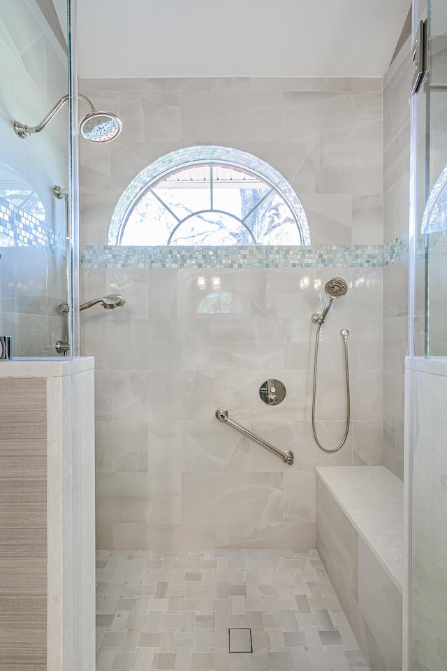 full bath featuring tiled shower