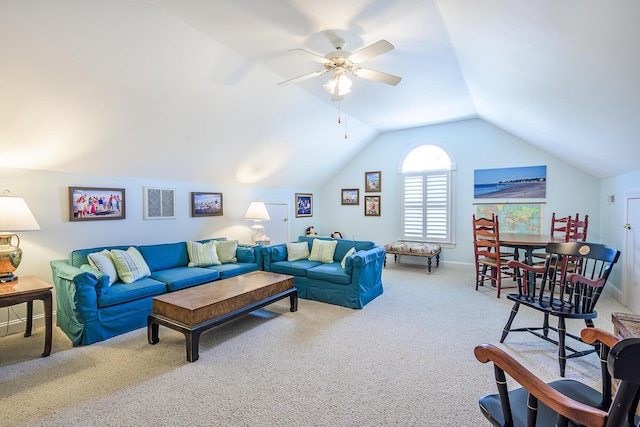 living room with baseboards, carpet flooring, a ceiling fan, and lofted ceiling