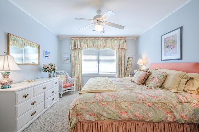 bedroom featuring crown molding, carpet flooring, and ceiling fan