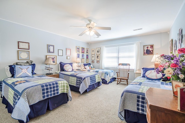 bedroom featuring visible vents, a ceiling fan, and carpet flooring