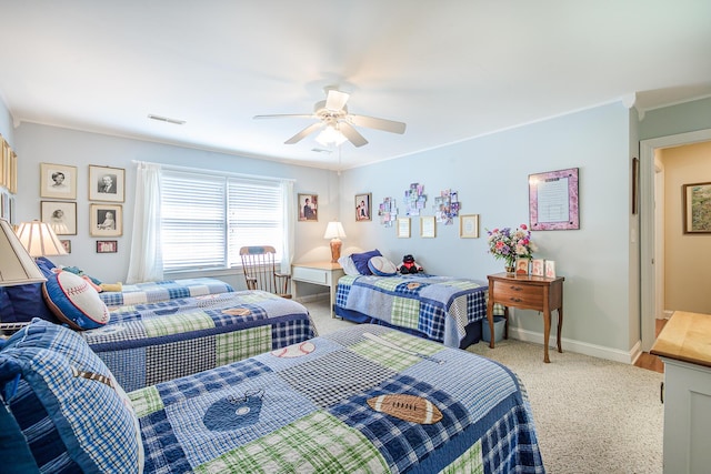 bedroom featuring a ceiling fan, light colored carpet, visible vents, and baseboards