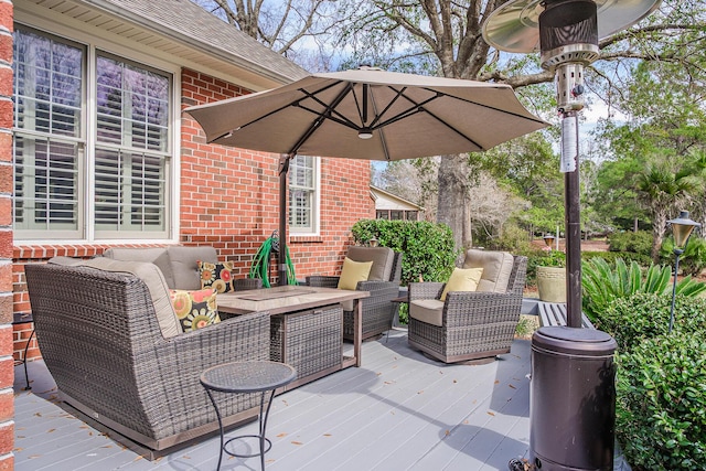 view of patio featuring an outdoor living space and a wooden deck