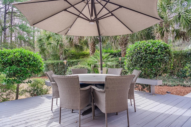 deck with outdoor dining area