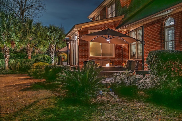 exterior space featuring brick siding