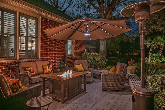 wooden terrace with outdoor lounge area