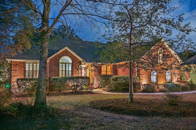 view of front of home with brick siding