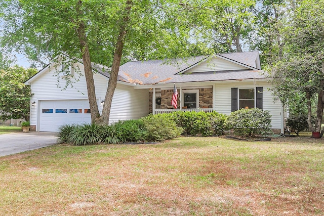 ranch-style house with covered porch, an attached garage, concrete driveway, roof with shingles, and a front lawn