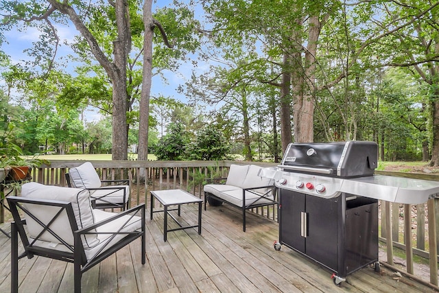 wooden deck featuring area for grilling and outdoor lounge area