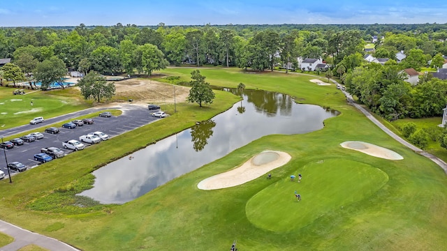 bird's eye view featuring a water view and view of golf course