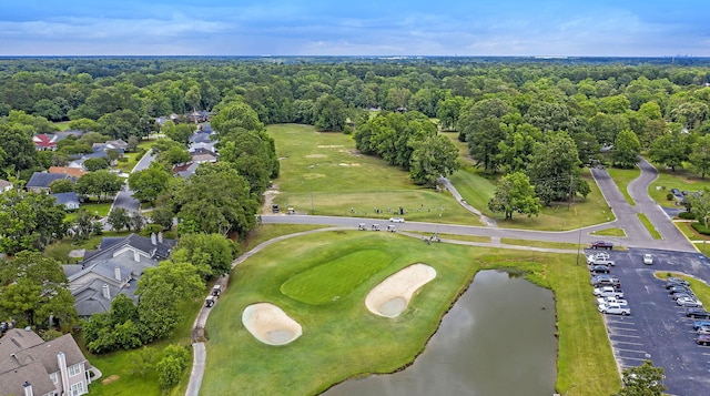 drone / aerial view featuring a water view, golf course view, and a residential view