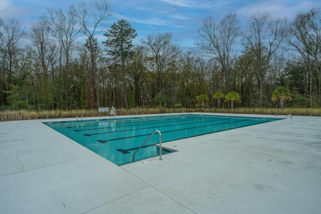 view of swimming pool with a patio area