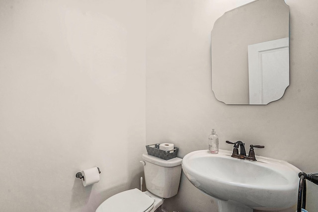 bathroom with sink and toilet