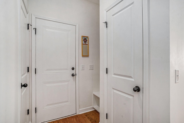 entryway with hardwood / wood-style flooring