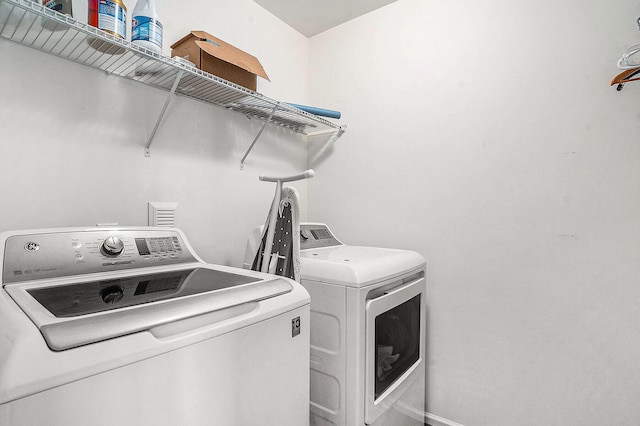 laundry area with separate washer and dryer