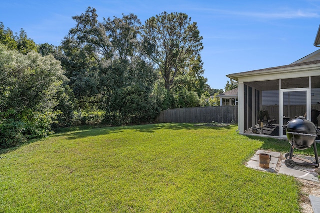 view of yard featuring a sunroom