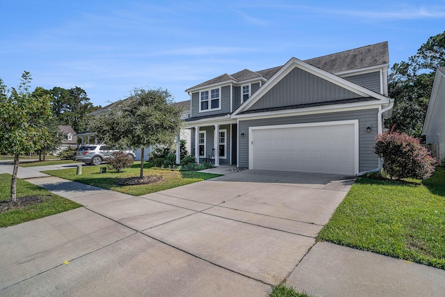 view of front of property featuring a front lawn and a garage