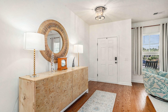 entrance foyer featuring dark hardwood / wood-style floors