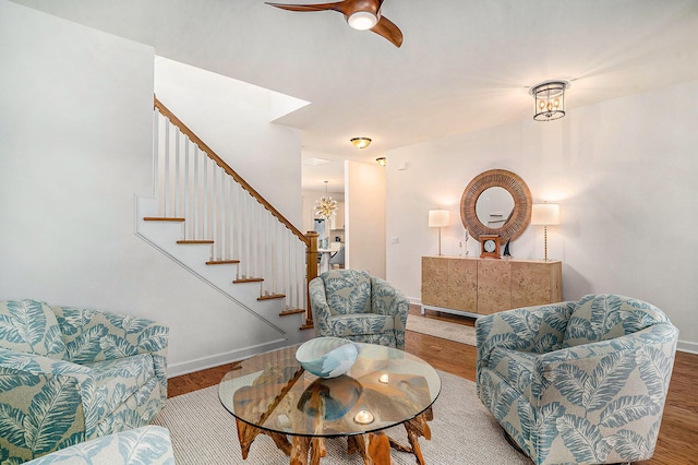 living room with hardwood / wood-style flooring and a chandelier