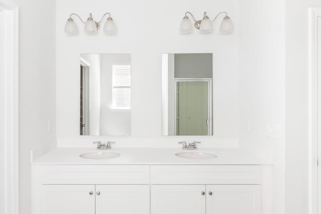 191 E Pinckney St, Summerville, SC 29485 - bathroom with double vanity and a shower with shower door
