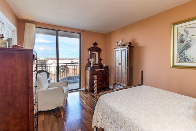330 Concord St Unit 8E, Charleston, SC 29401 - bedroom featuring dark wood finished floors, access to outside, and baseboards