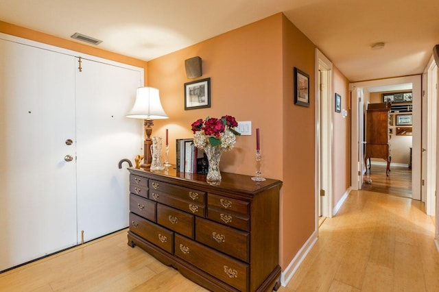 330 Concord St Unit 8E, Charleston, SC 29401 - hallway with light wood finished floors and baseboards