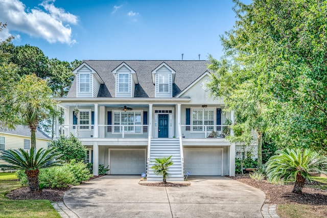 view of front of house with a porch, a garage, and ceiling fan