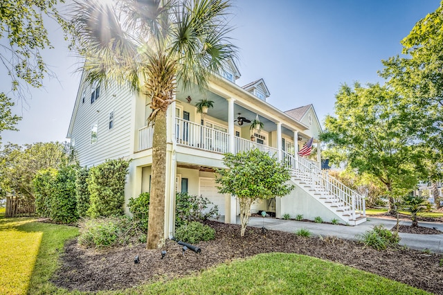 view of front of house with ceiling fan and covered porch