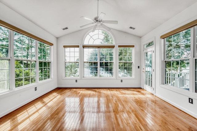 unfurnished sunroom with vaulted ceiling and ceiling fan