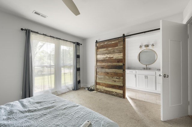1445 Downwood Pl, Charleston, SC 29412 - bedroom with light colored carpet and a barn door