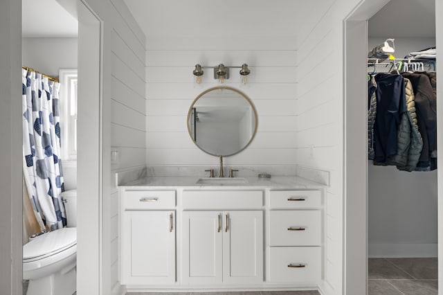 1445 Downwood Pl, Charleston, SC 29412 - bathroom with vanity, toilet, a walk in closet, tile patterned floors, and a shower with curtain