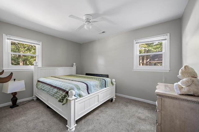 1445 Downwood Pl, Charleston, SC 29412 - carpeted bedroom with multiple windows, baseboards, and ceiling fan
