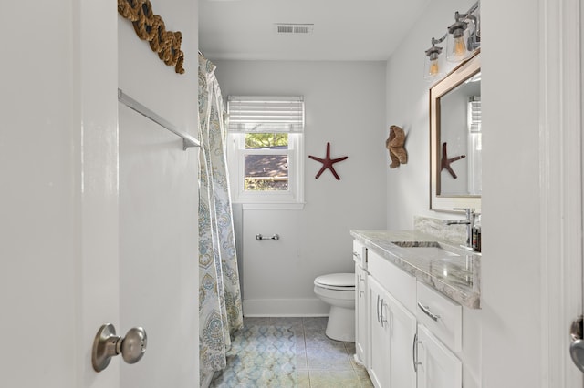1445 Downwood Pl, Charleston, SC 29412 - bathroom with toilet, vanity, baseboards, and curtained shower
