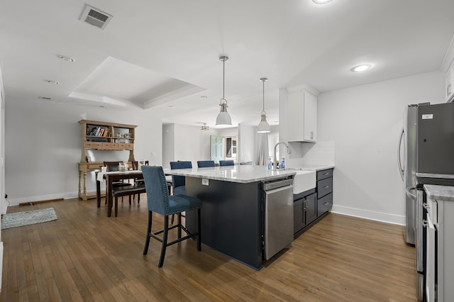 1445 Downwood Pl, Charleston, SC 29412 - kitchen with appliances with stainless steel finishes, a sink, a peninsula, and baseboards
