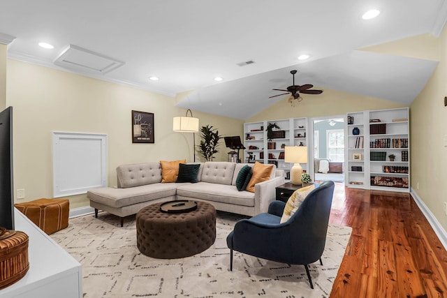 living room featuring ceiling fan, lofted ceiling, ornamental molding, and hardwood / wood-style flooring