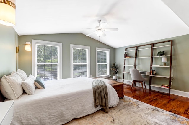 bedroom featuring ceiling fan, wood-type flooring, and lofted ceiling