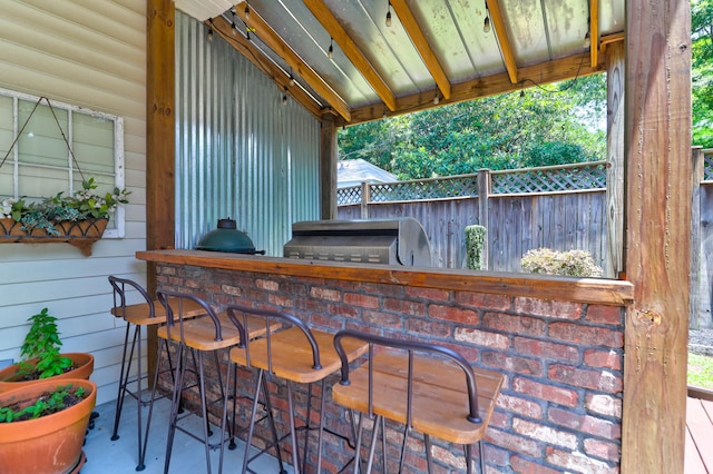 view of patio featuring exterior bar