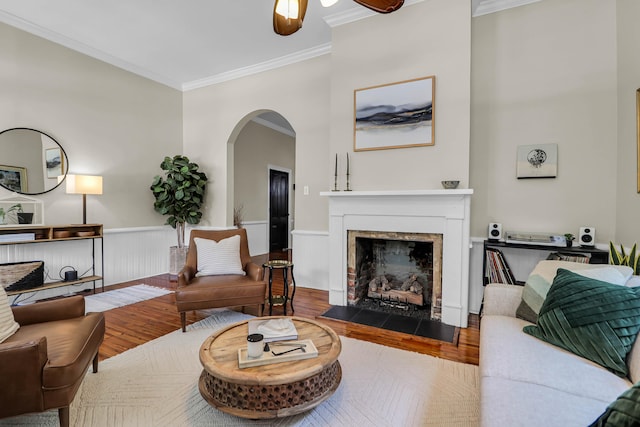 living room with ornamental molding and hardwood / wood-style floors